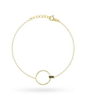 Gold circle bracelet and black stone in a rectangle