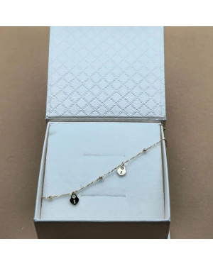 Gold bracelet with diamond-cut beads and locks