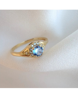 Gold engagement ring blue stone