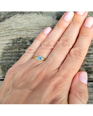 Gold engagement ring blue stone