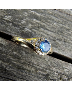 Gold engagement ring blue stone