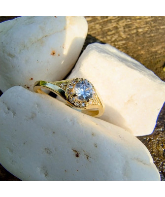 Gold engagement ring blue stone