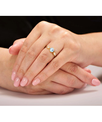 Ring with a large blue stone