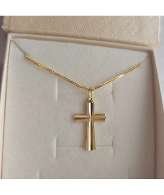 Golden cross adorned with diamond cutting