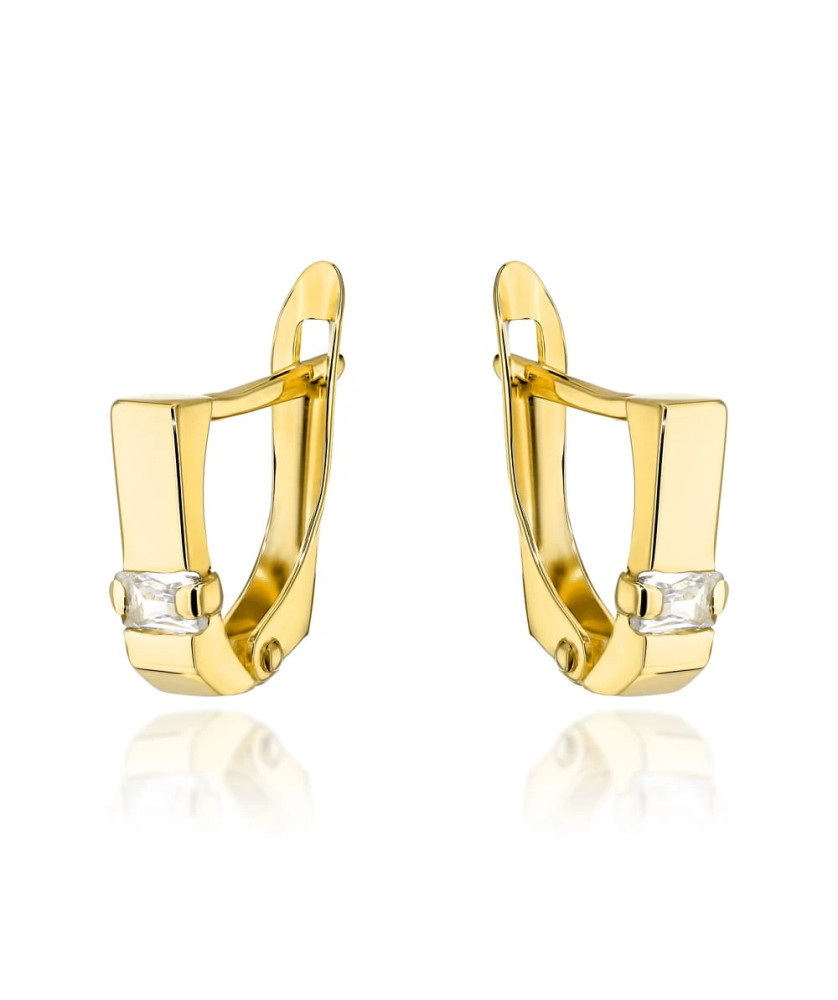 Gold earrings with a white rectangular stone