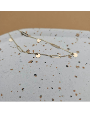 Gold bracelet with links and solid circles