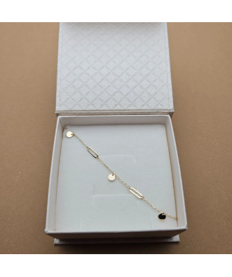 Gold bracelet with links and solid circles