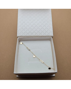 Gold bracelet with links and solid circles