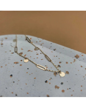 Gold bracelet with links and solid circles