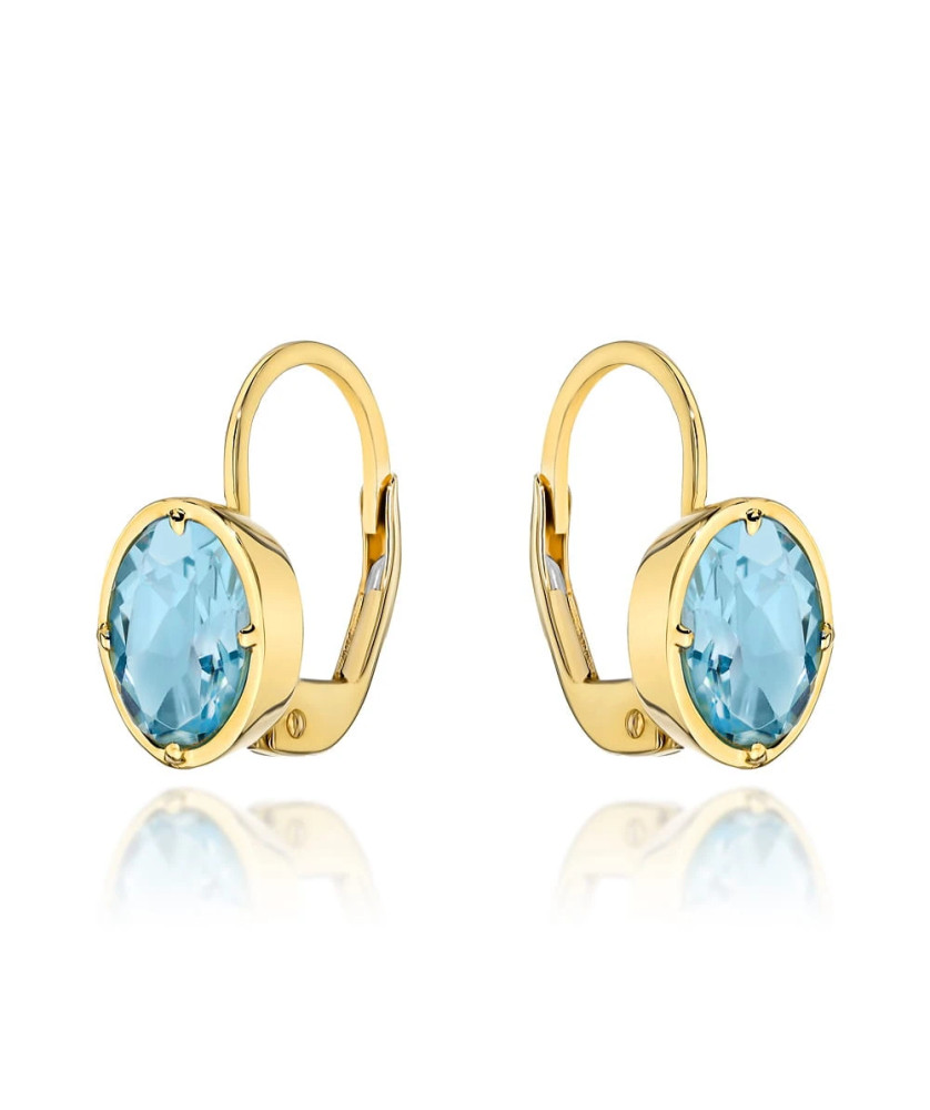 14k gold earrings with an oval stone in Topaz color