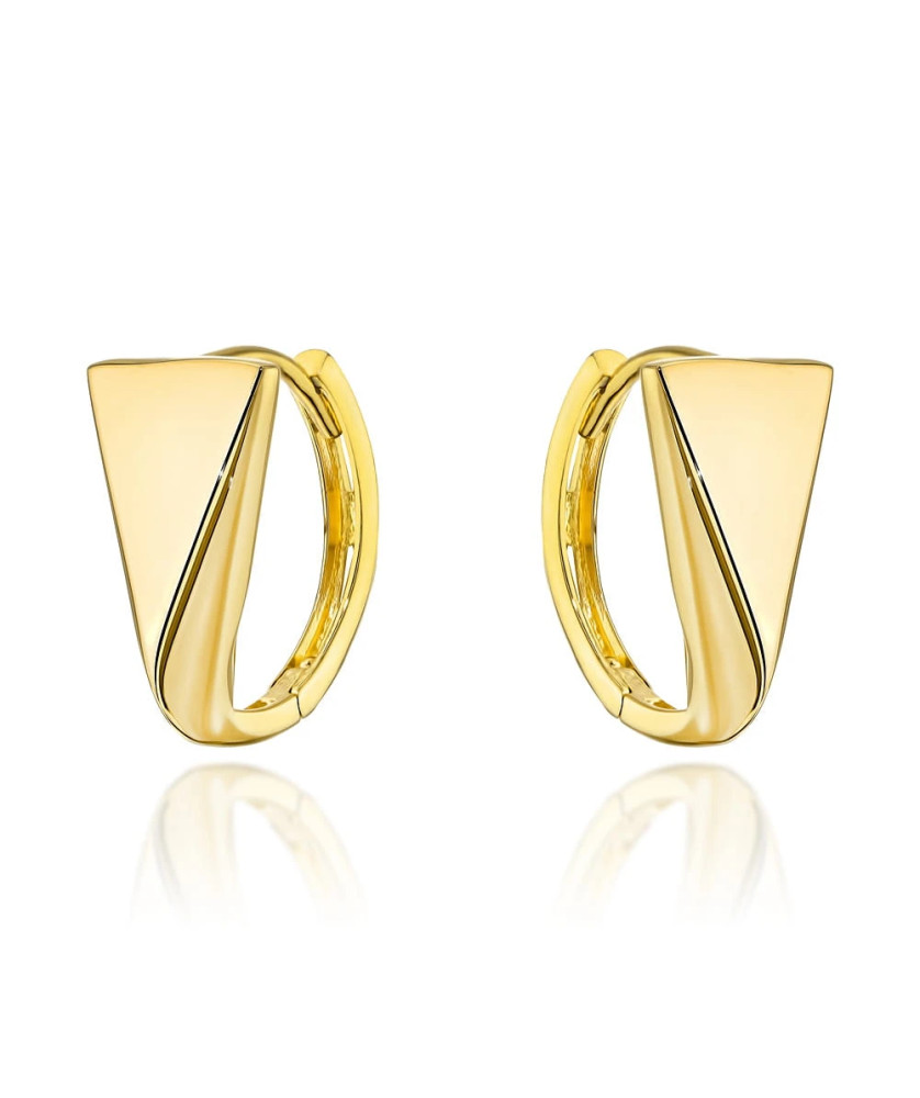 Gold triangle earrings on creole