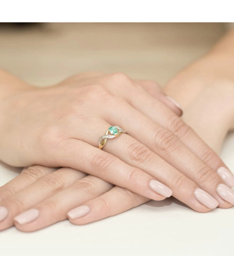 14k gold ring interwoven emerald diamonds