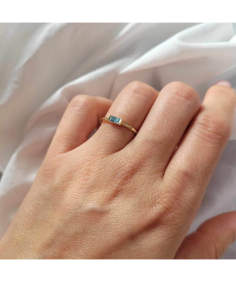 Delicate gold ring with light blue stone 14k