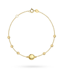 Gold bracelet with a circle and diamond-cut beads