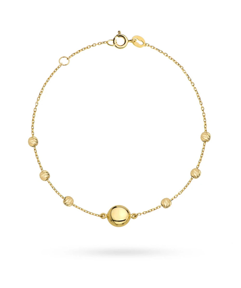 Gold bracelet with a circle and diamond-cut beads