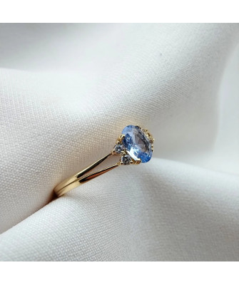 14k gold ring with a large blue stone