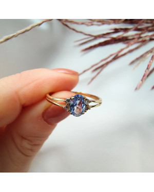 14k gold ring with a large blue stone