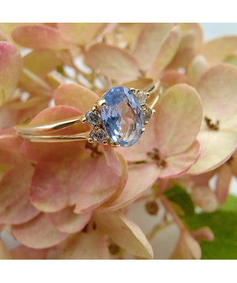 14k gold ring with a large blue stone