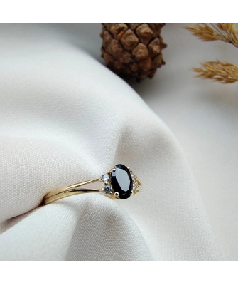 14k gold ring with a large blue stone