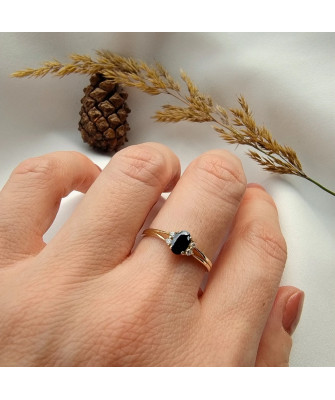 14k gold ring with a large blue stone