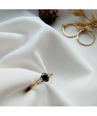 14k gold ring with a large blue stone