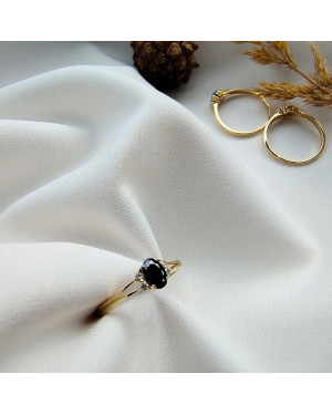 14k gold ring with a large blue stone